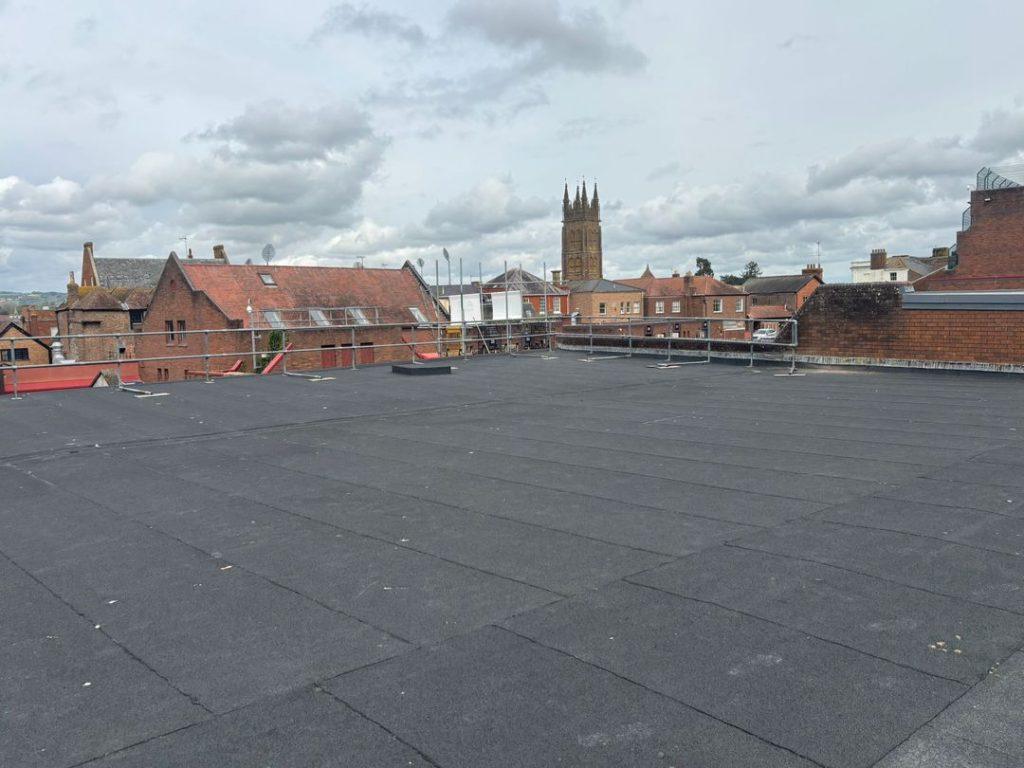 flat roofing with scaffolding